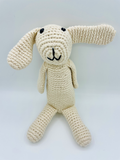 Handmade organic cotton bunny rattle in soft neutral tones, Fairtrade and ethically crafted for babies