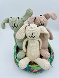 Handmade organic cotton bunny rattle in soft neutral tones, Fairtrade and ethically crafted for babies