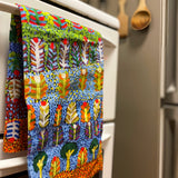 Cotton tea towel featuring licensed Aboriginal artwork, ethically printed in India using water-based inks—gentle on fabric and planet.