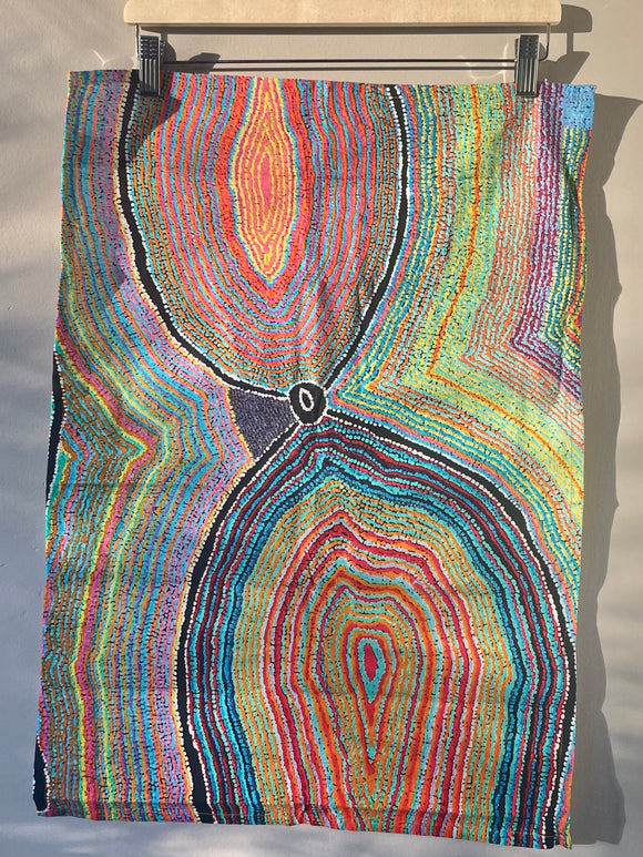 Cotton tea towel featuring licensed Aboriginal artwork, ethically printed in India using water-based inks—gentle on fabric and planet.