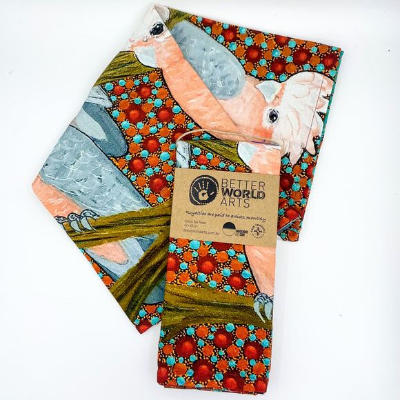 Cotton tea towel featuring licensed Aboriginal artwork, ethically printed in India using water-based inks—gentle on fabric and planet.