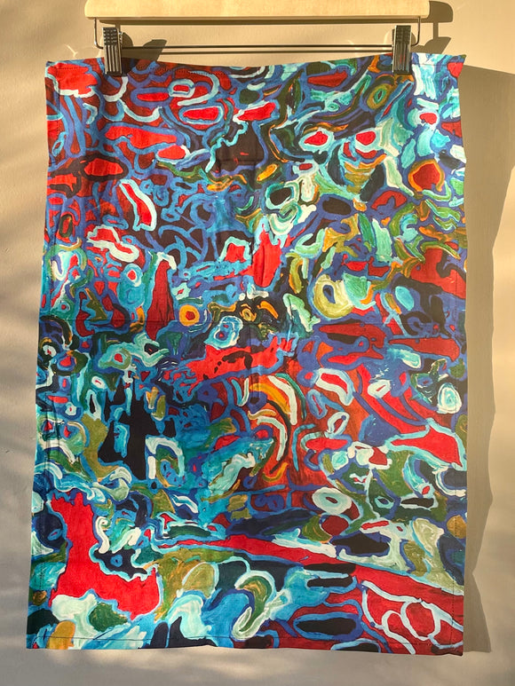 Cotton tea towel featuring licensed Aboriginal artwork, ethically printed in India using water-based inks—gentle on fabric and planet.