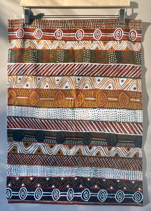 Cotton tea towel featuring licensed Aboriginal artwork, ethically printed in India using water-based inks—gentle on fabric and planet.