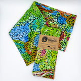 Cotton tea towel featuring licensed Aboriginal artwork, ethically printed in India using water-based inks—gentle on fabric and planet.