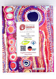 Packaging of the square table cloth featuring the vibrant, multicolored pattern on the box. 