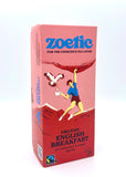Zoetic Organic English Breakfast tea packaging depicts a person rock-climbing with bird of prey holding a tea bag next to them. The illustration is on a pink background with red rocks/mountains.
